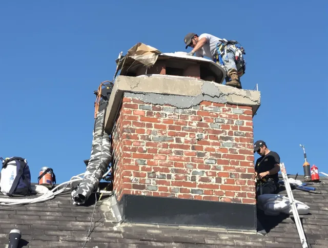 Orlando Chimney Sweep installing a custom chimney crown in Orlando, FL
