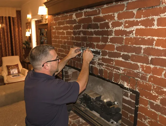 Orlando Chimney Sweep expert fixing a fireplace in Orlando, FL